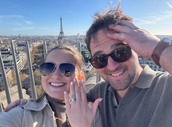 Will and Brooklyn taking a selfie above Paris, ring in view