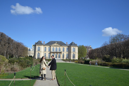 Will and Brooklyn walking hand in hand through the Musée Rodin garden